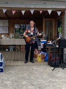 David Hood from Music in Hospitals and Care performs his guitar during our BBQ at Linburn