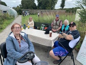 Veterans and families sat round a table during our BBQ at Linburn