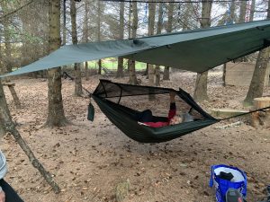 A female veteran laying in a hammock