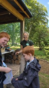 OP Cairngorm staff member laughing with two veterans children
