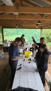Veterans and their families crafting at a table during OP Cairngorm trip