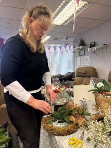 One female veterans making their Christmas wreath