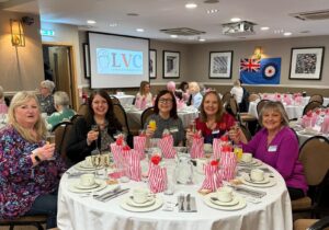 Group of female veterans sat at a table