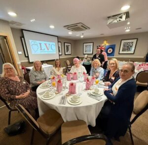 Group of female veterans sat at a table