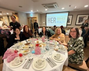 Group of female veterans sat at a table