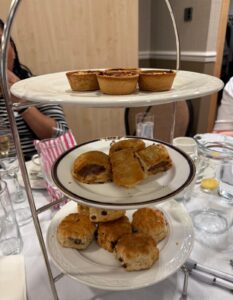 Selection of sausage rolls, quiches and scones on a table