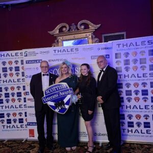 LVC team pose with Scottish Veterans Awards plaque